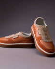 Helios Sunset Orange sneaker - lifestyle photograph